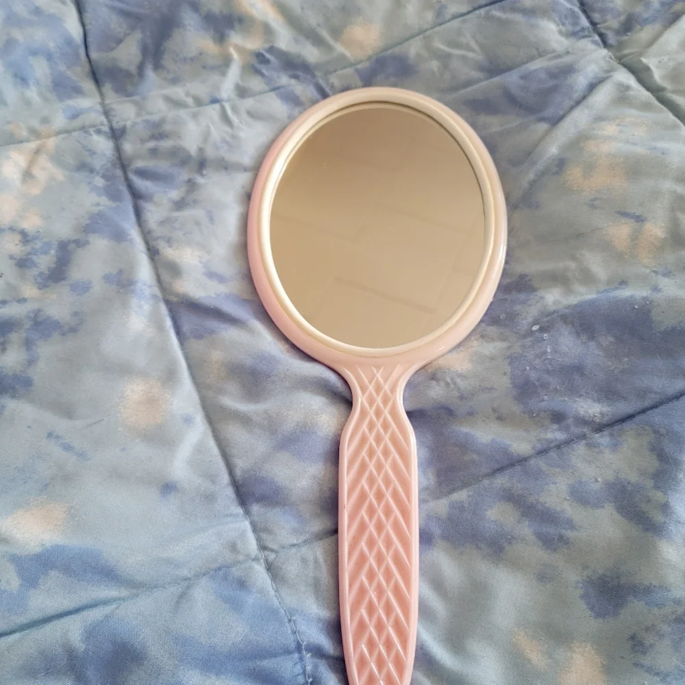 Hand held mirror